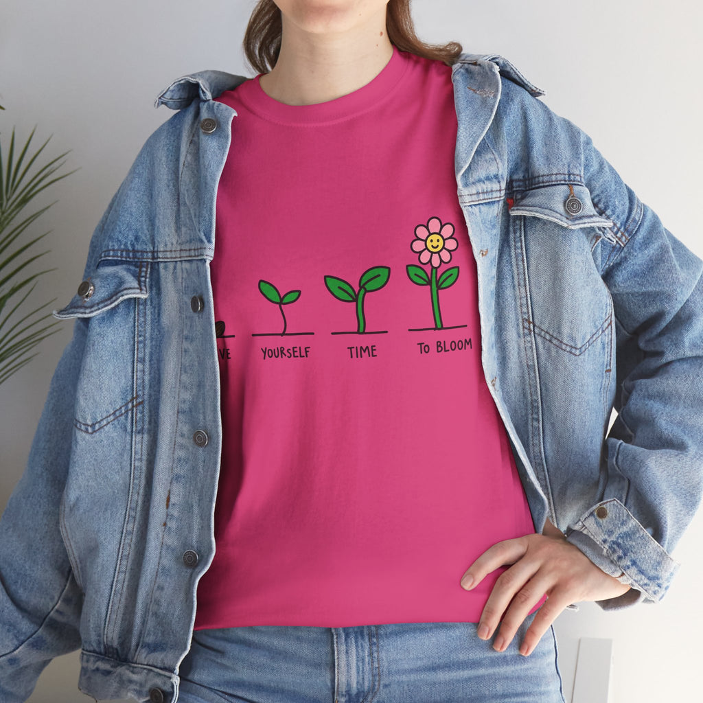 Light pink crew-neck graphic t-shirt with green sprout and flower print, close view