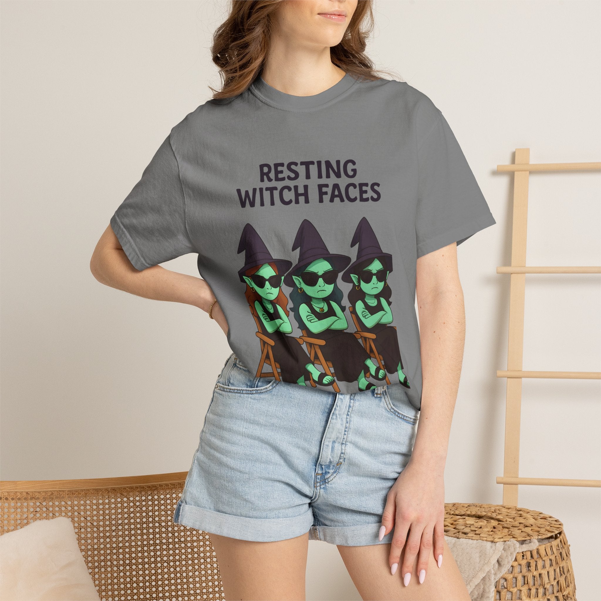 Gray crew-neck graphic T-shirt with witch faces print on model
