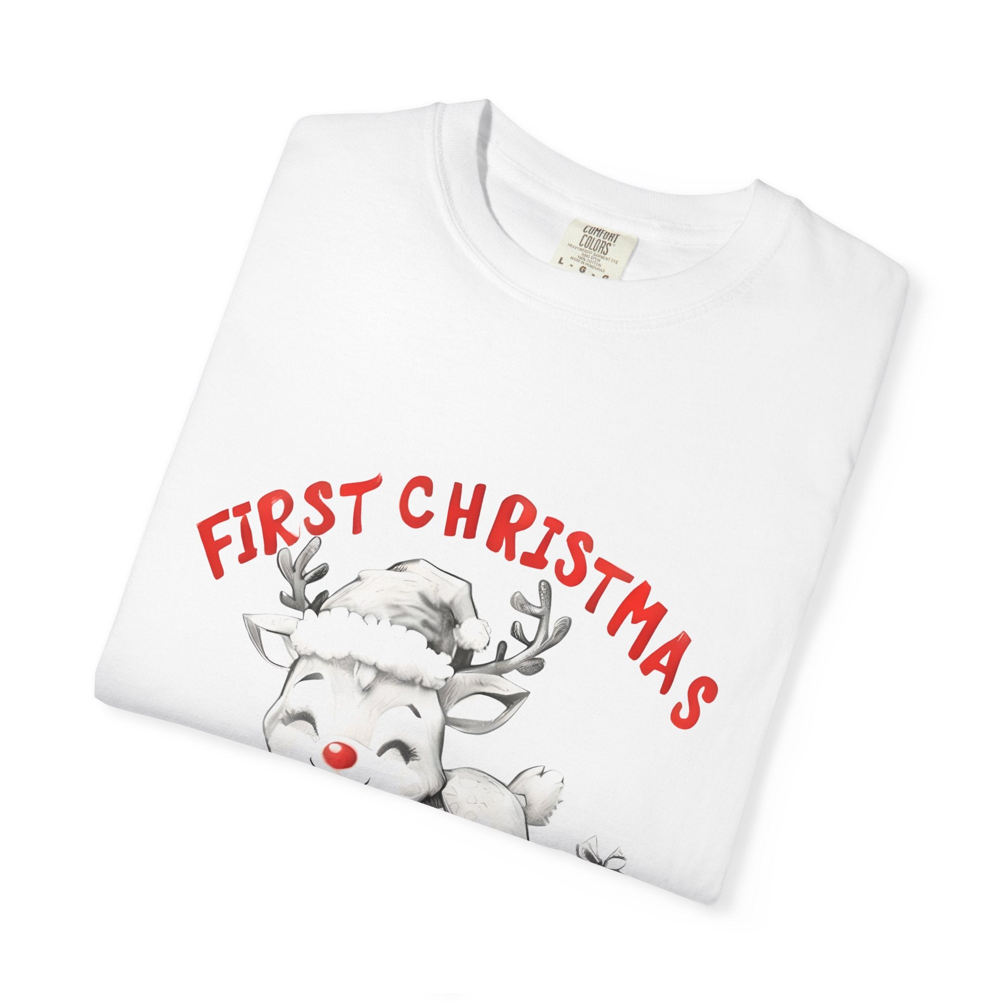 White T-shirt close-up showing “First Christmas” reindeer and “MUMMA” graphic