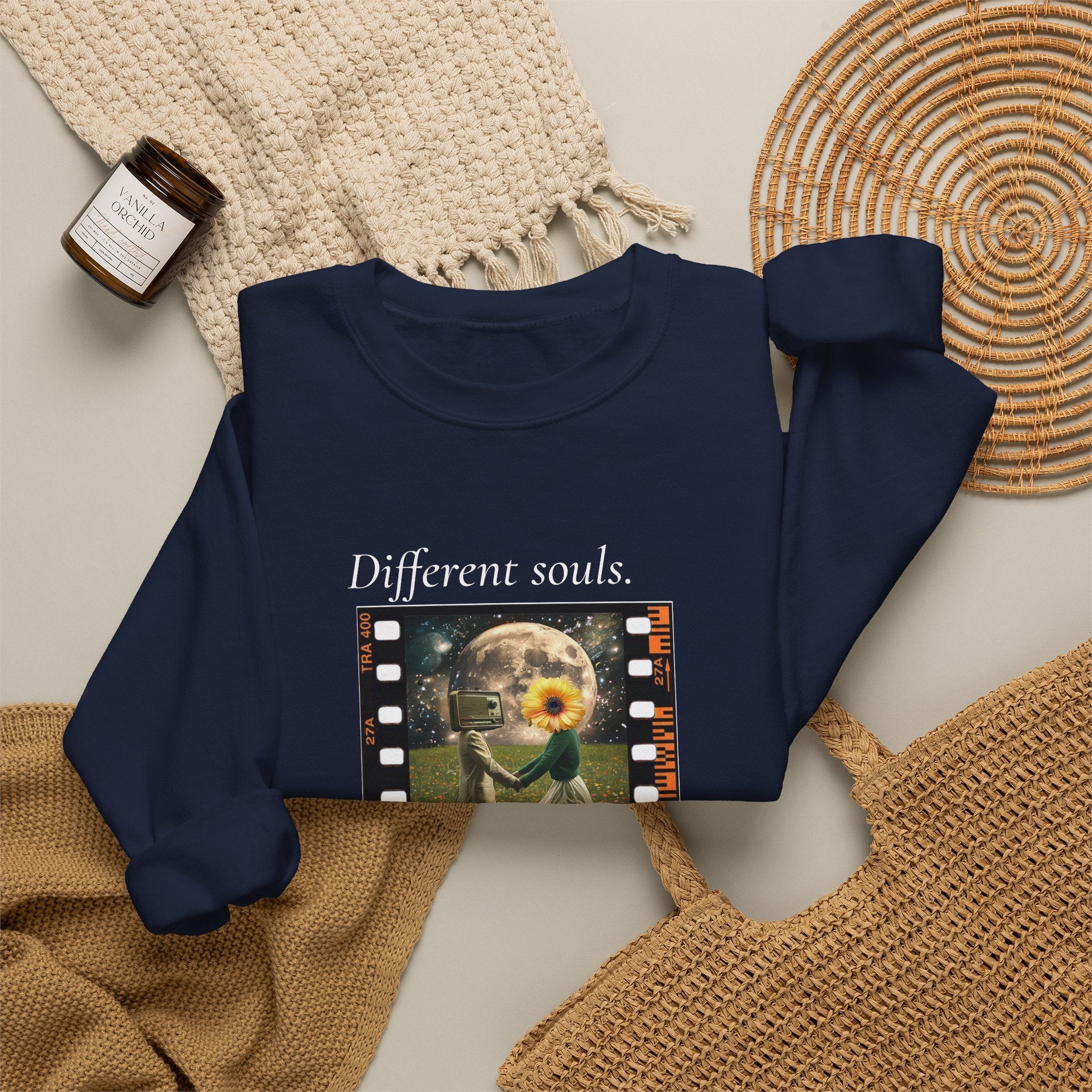 Navy crewneck sweatshirt with long sleeves and front filmstrip-style graphic