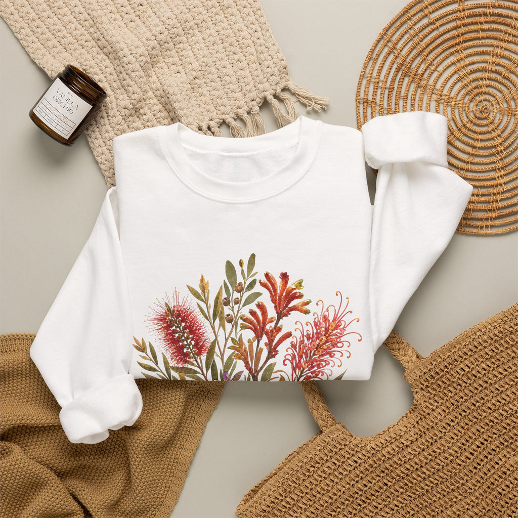 White crewneck sweatshirt with colorful floral bouquet graphic on the front.