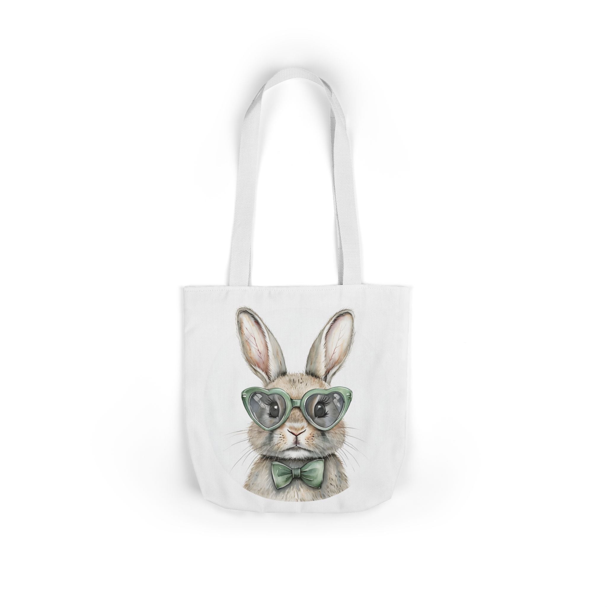 White canvas tote bag with bunny face wearing green glasses and bow, front