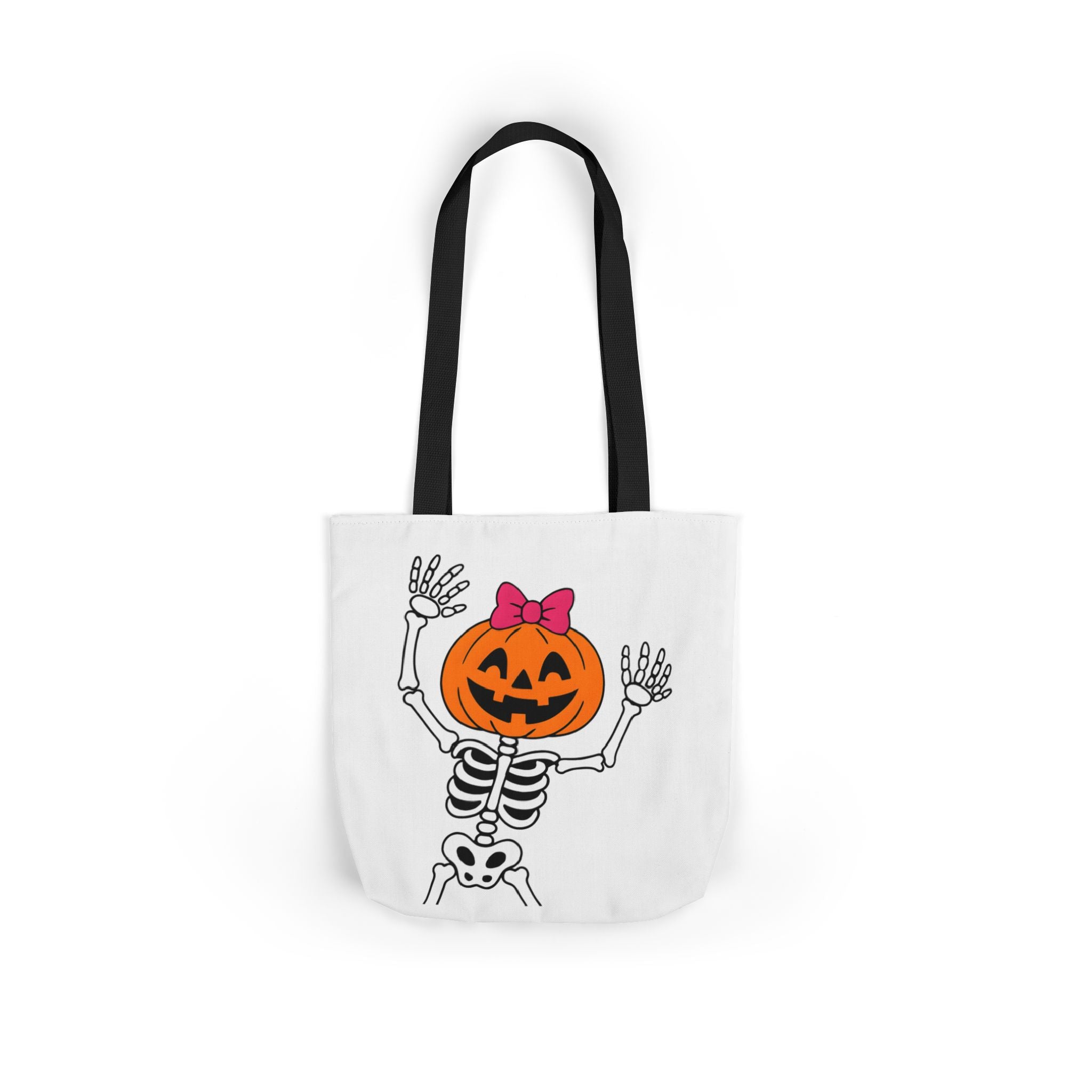 White canvas tote bag with black handles, front view of pumpkin skeleton Halloween print