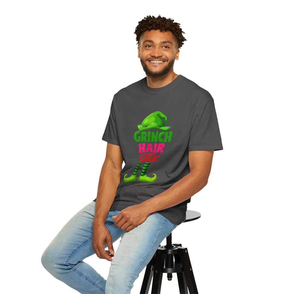 Charcoal graphic T-shirt with Grinch Hair Care front print, man seated