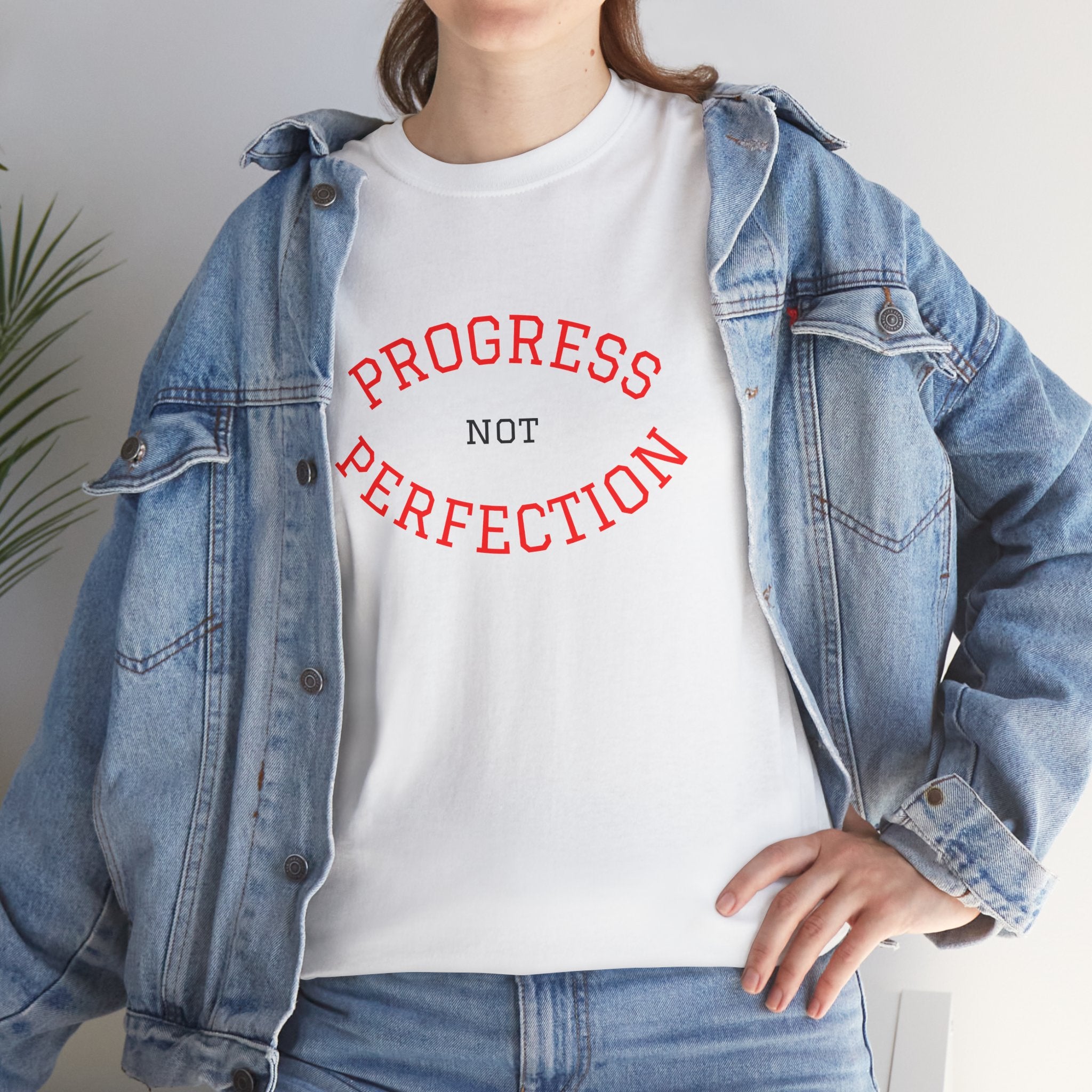 White unisex cotton tee with red "PROGRESS" and "PERFECTION" slogan graphic