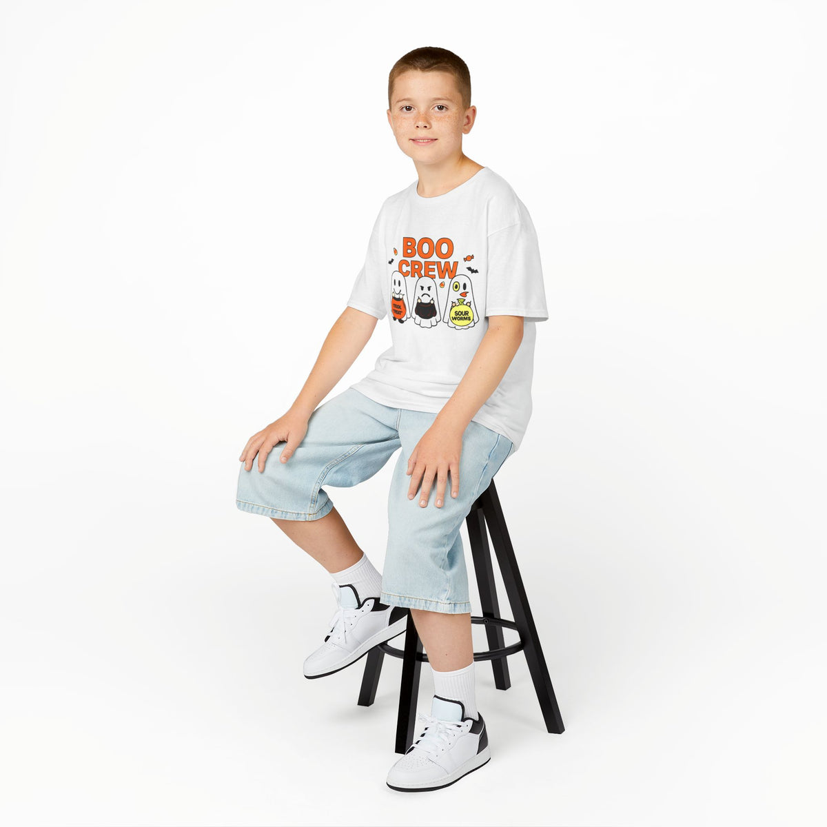 Kids white 'Boo Crew' Halloween T-shirt worn with blue shorts and sneakers