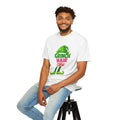 White graphic t-shirt with green character “Hair Don’t Care” print on front