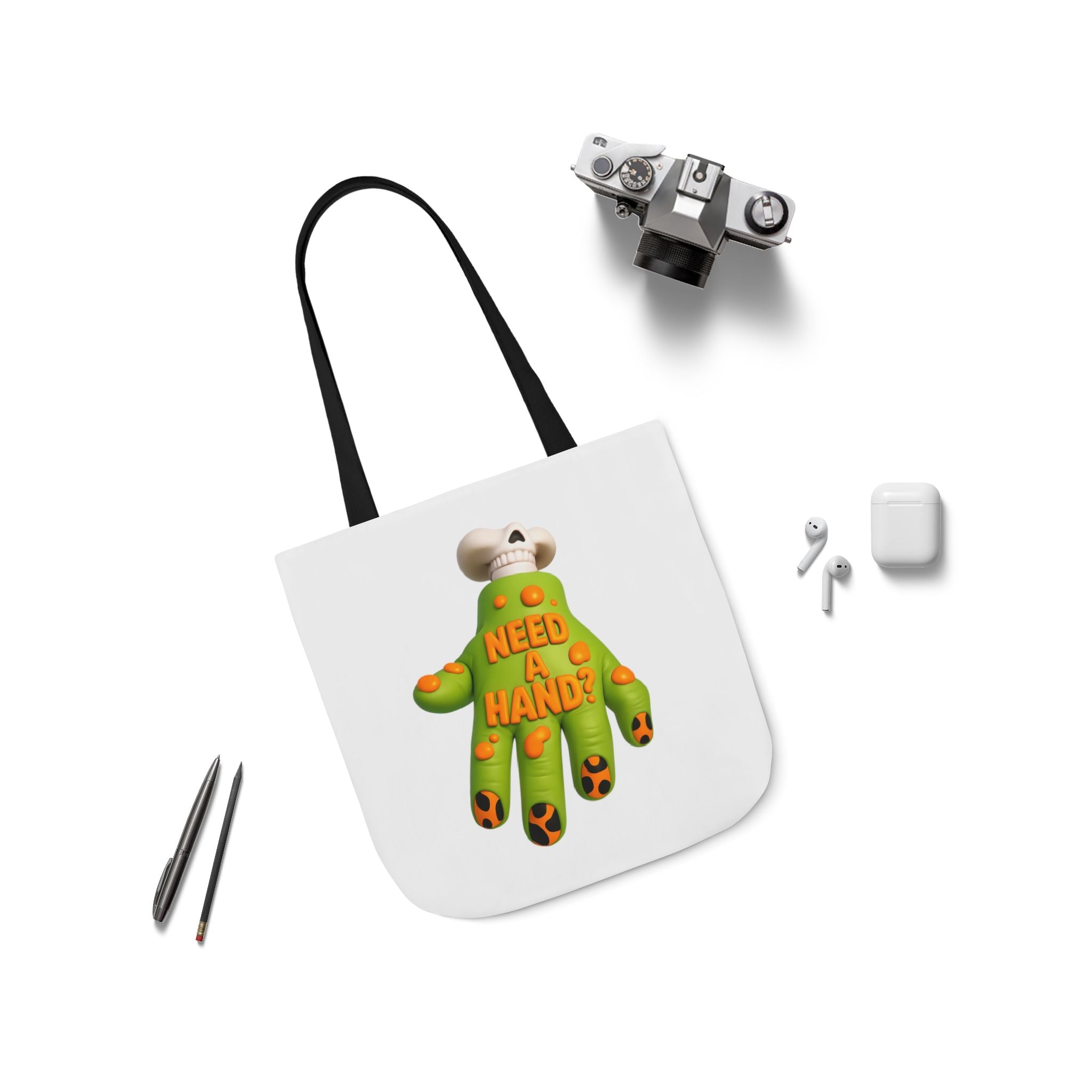 White canvas tote bag with black straps and centered "Need A Hand" hand graphic.
