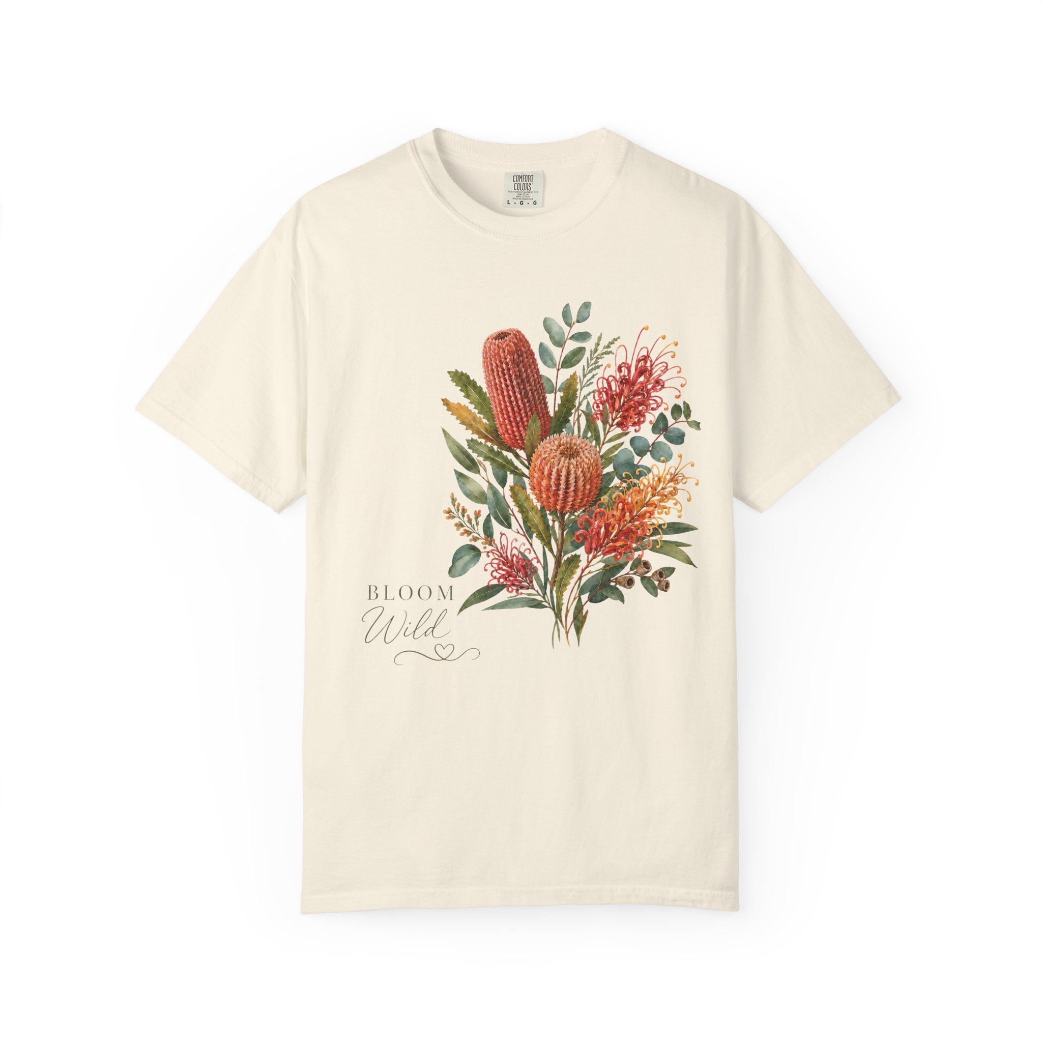 Ivory crew-neck t-shirt with colorful protea bouquet graphic and “Bloom Wild” script