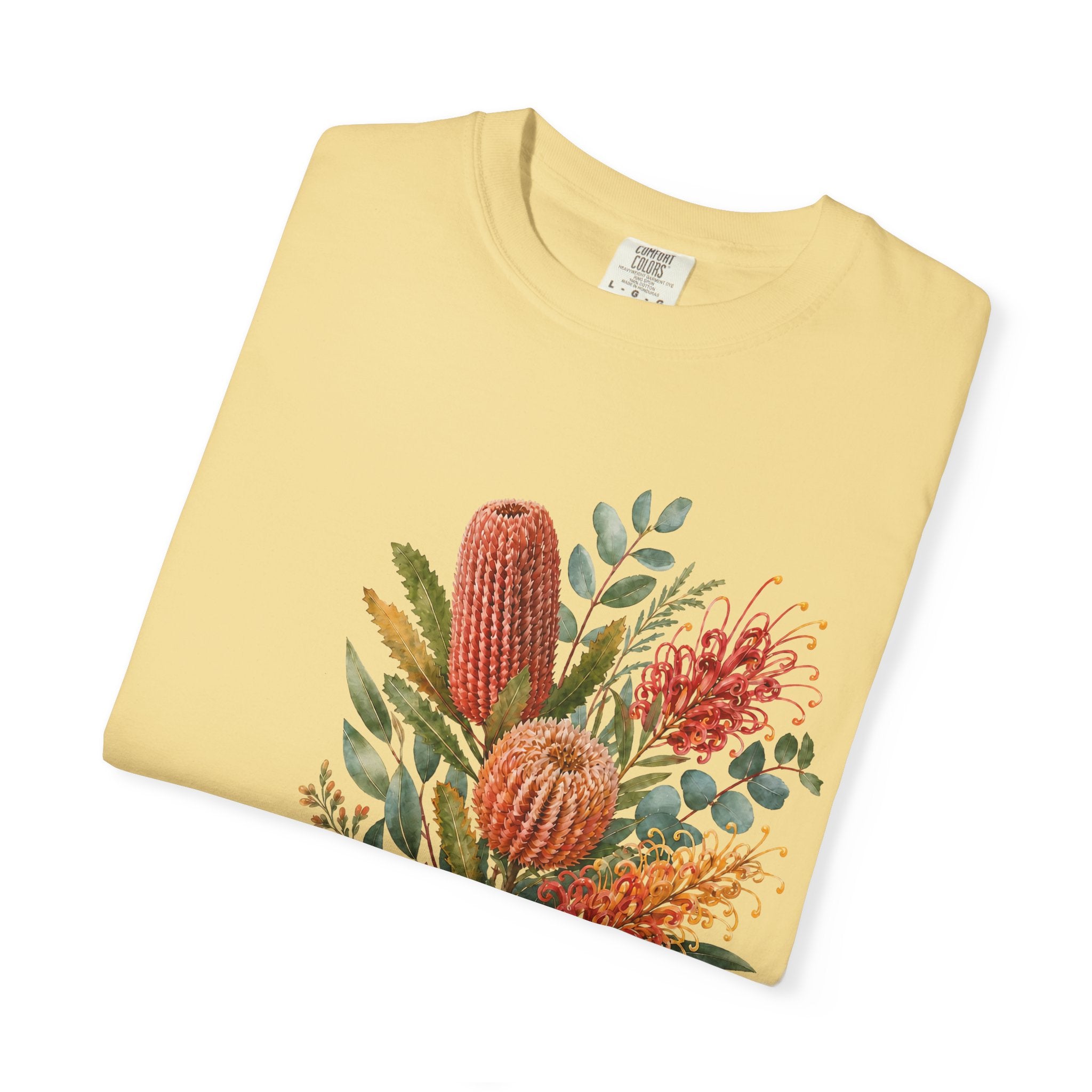 Butter T-shirt featuring a colorful protea and floral bouquet graphic in the center