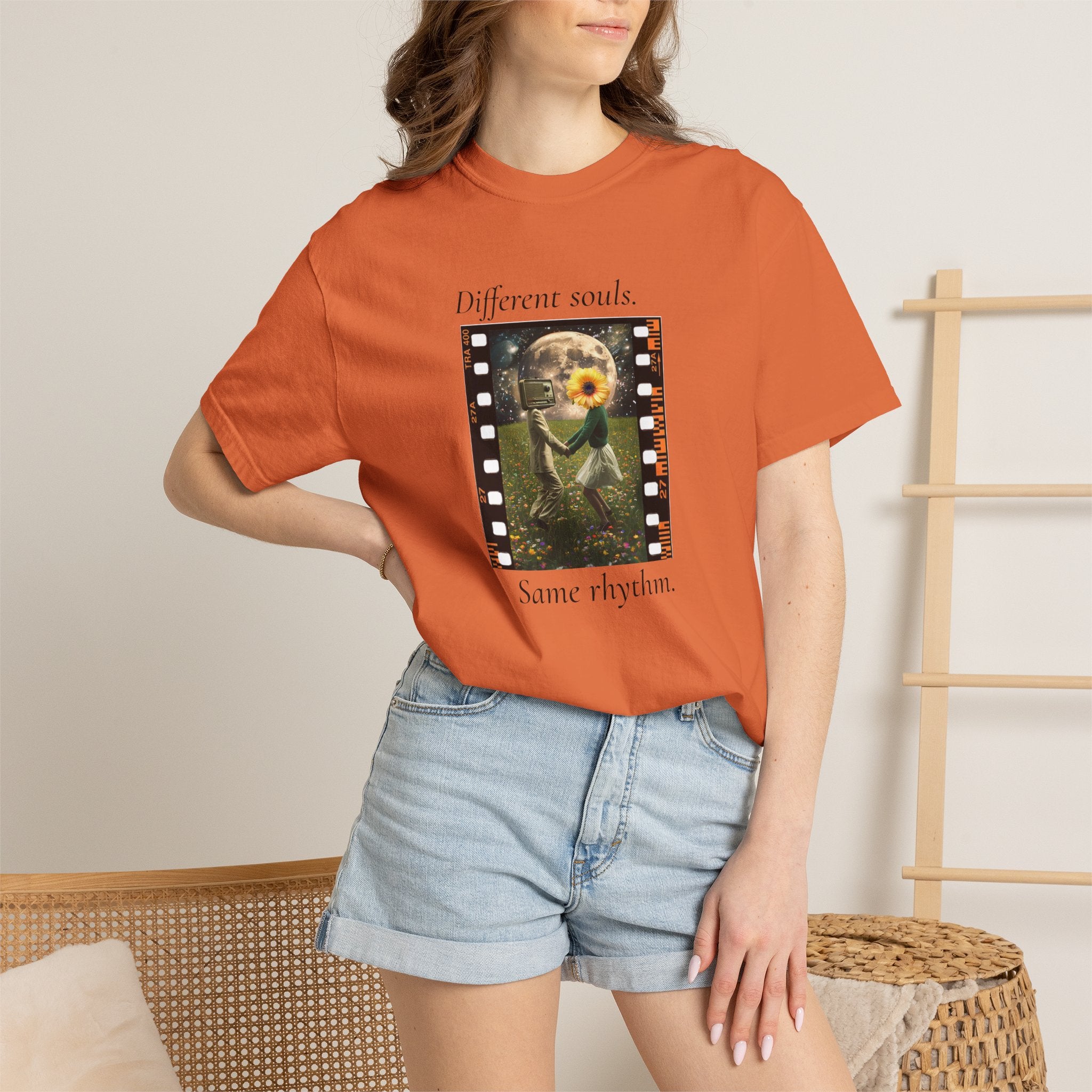 Orange crew-neck short-sleeve tee on model, with filmstrip sunflower front print