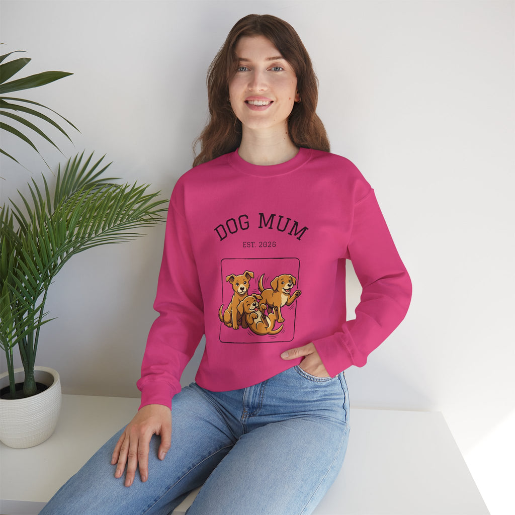Pink crewneck sweatshirt on seated model, DOG MUM est. 2026 puppy graphic