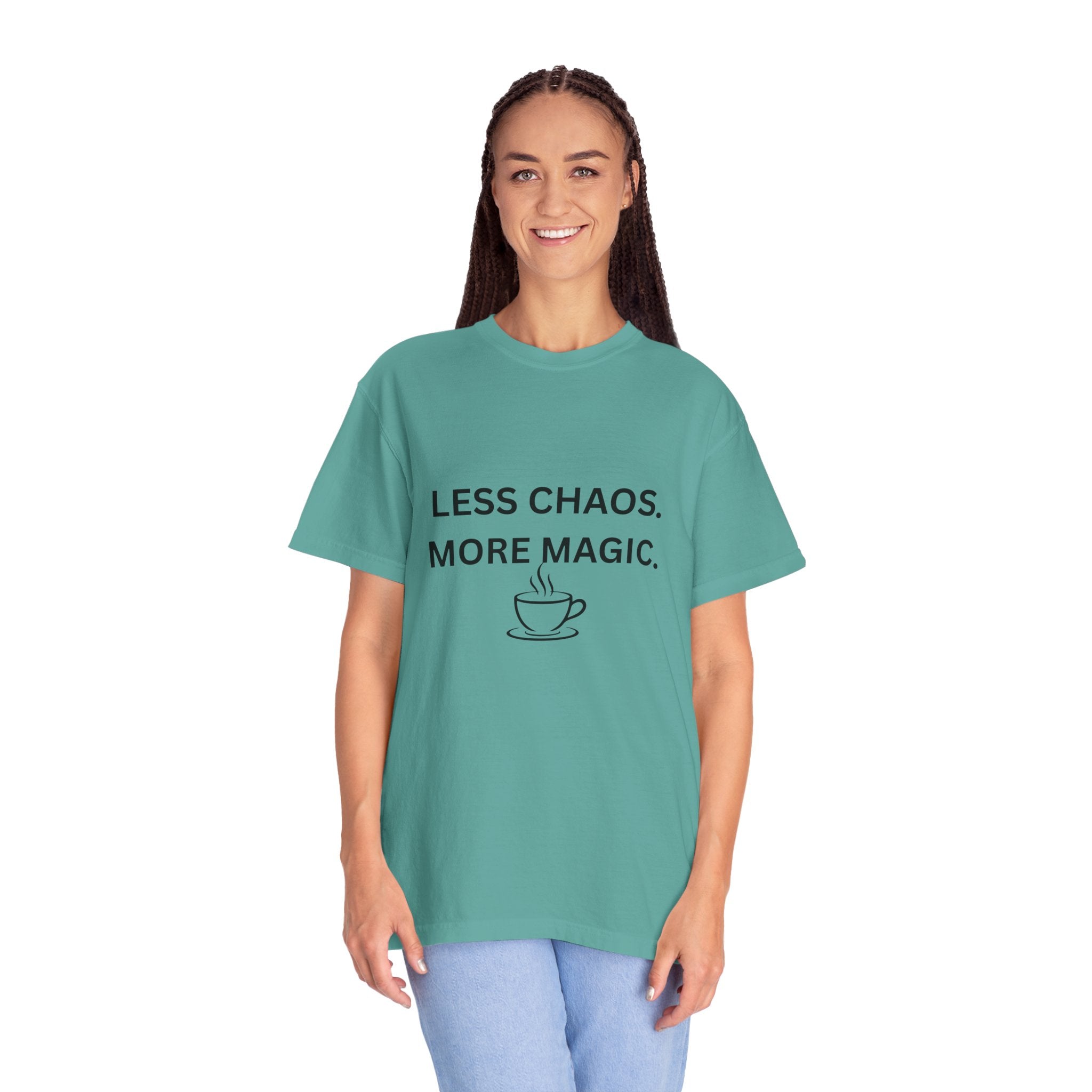 Teal T-shirt with “LESS CHAOS. MORE MAGIC.” text and a coffee cup graphic