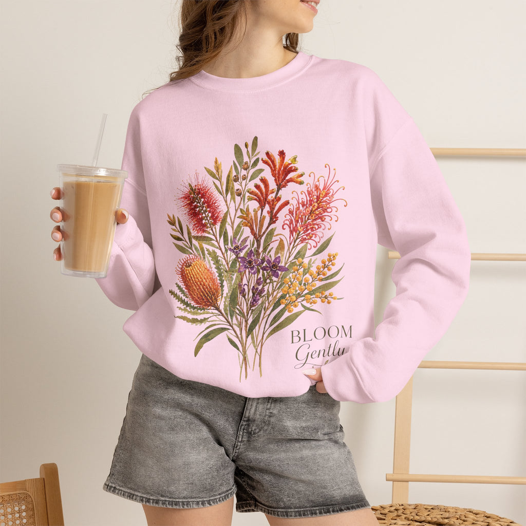 Light pink crewneck sweatshirt with multicolor floral bouquet graphic.