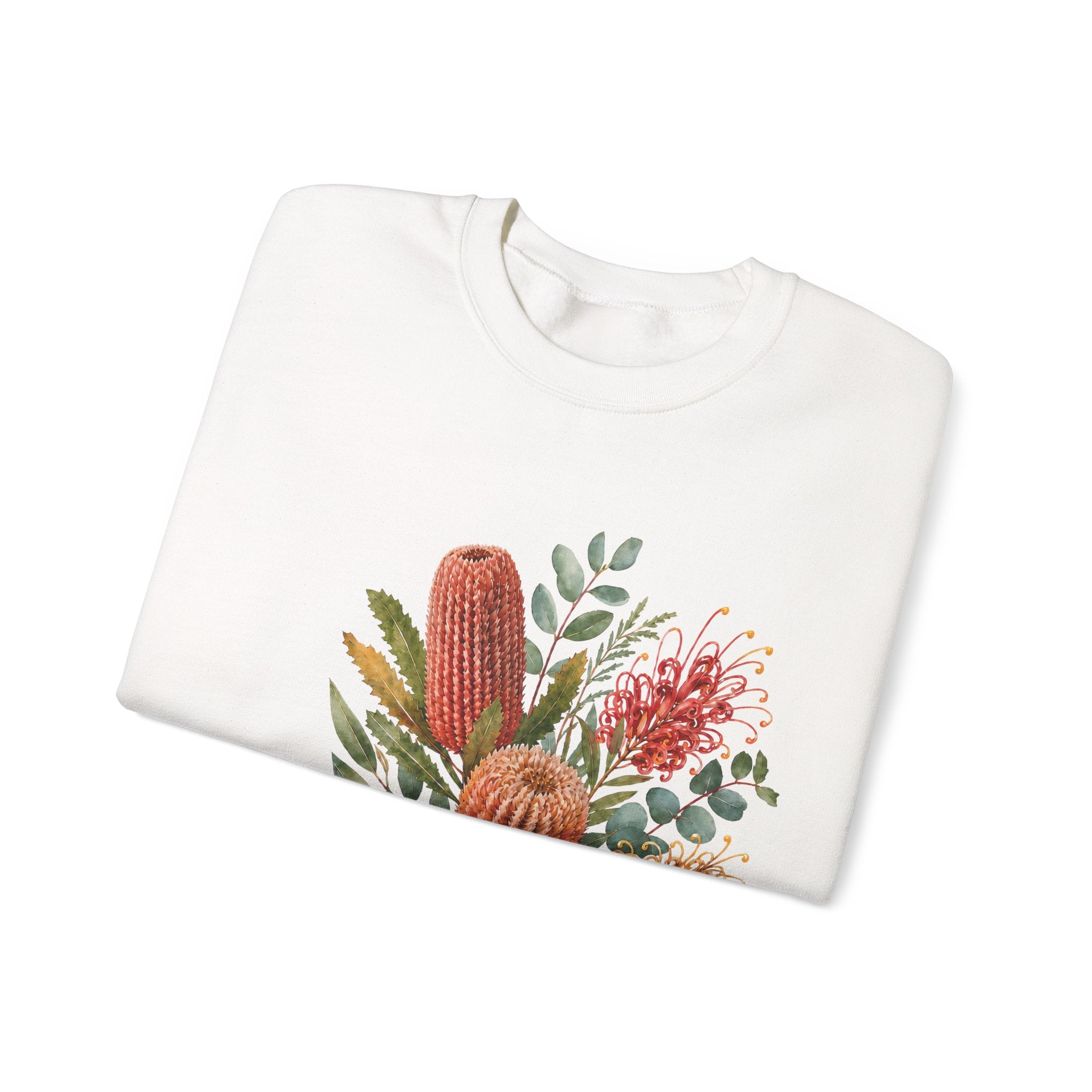 White crewneck sweatshirt folded flat with wildflower graphic across the chest