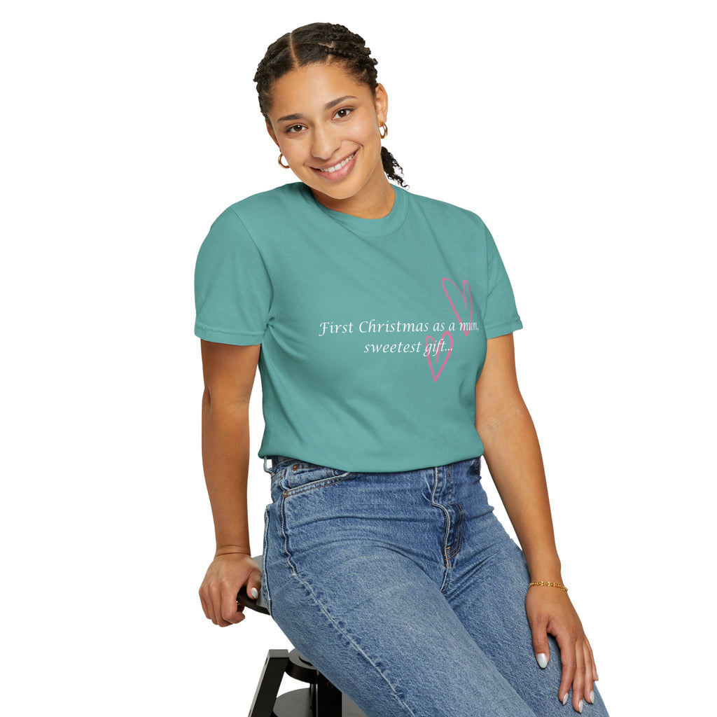 Teal crewneck T-shirt on model with pink heart graphic and 'First Christmas as a mum' text