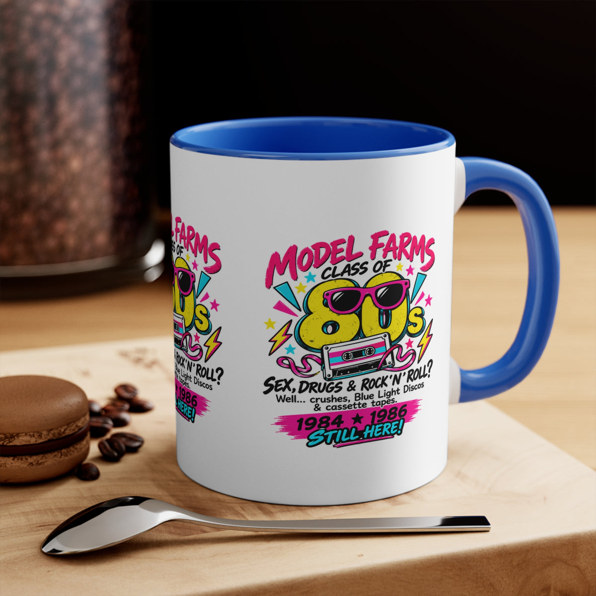 White ceramic mug with blue handle and interior, retro cassette graphic