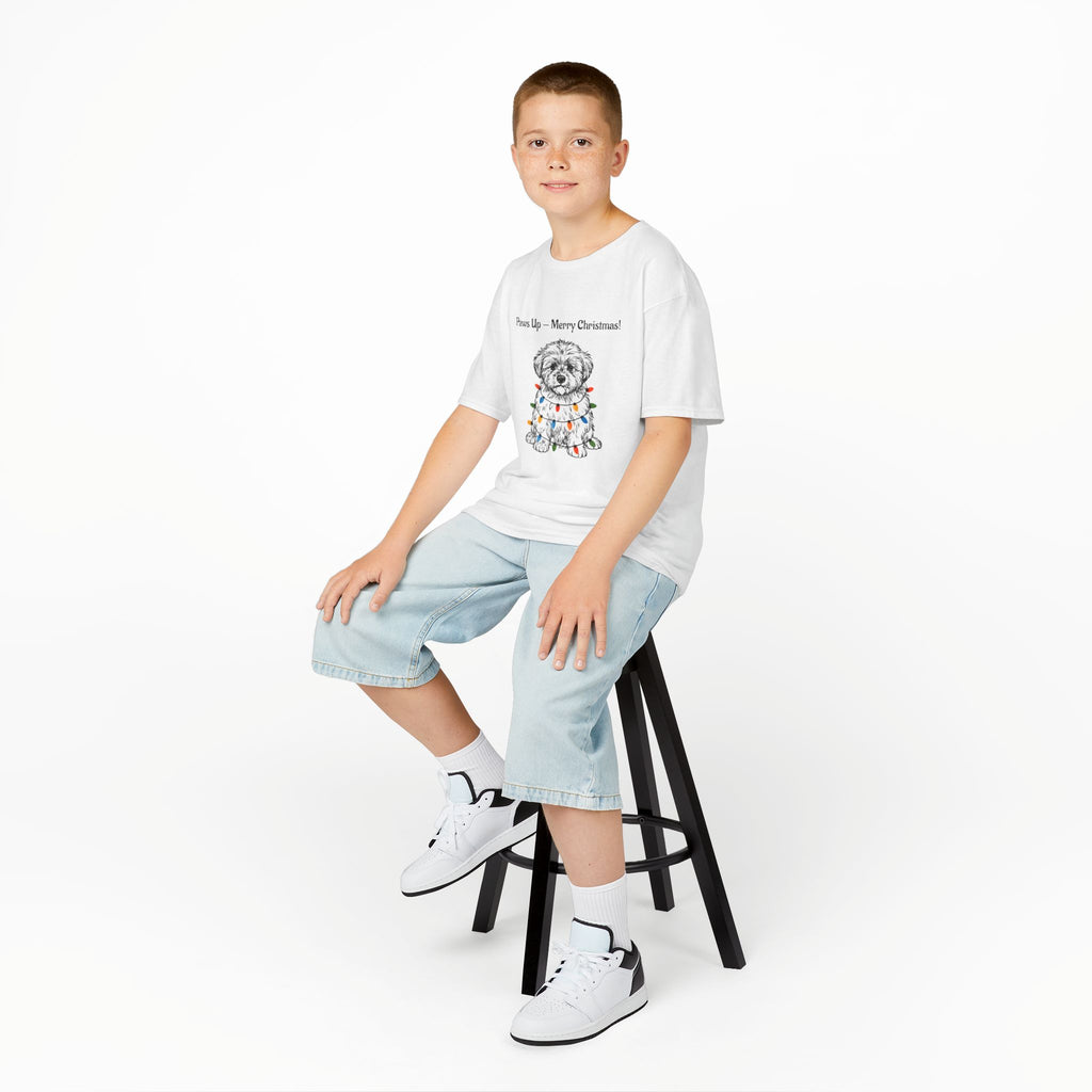 Kids white T-shirt worn by child, with Paw-sit dog Christmas graphic at center