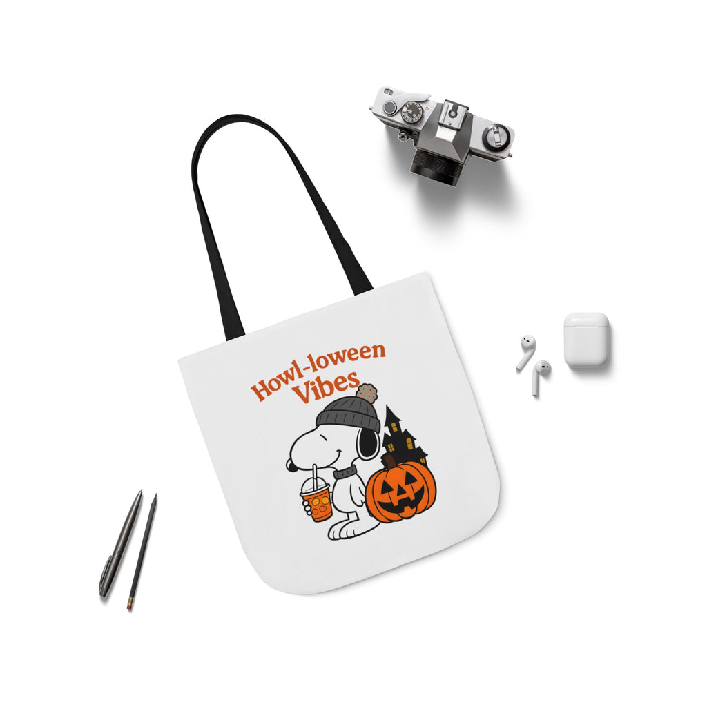 White canvas tote with black handles and 'Howl-loween Vibes' pumpkin dog graphic