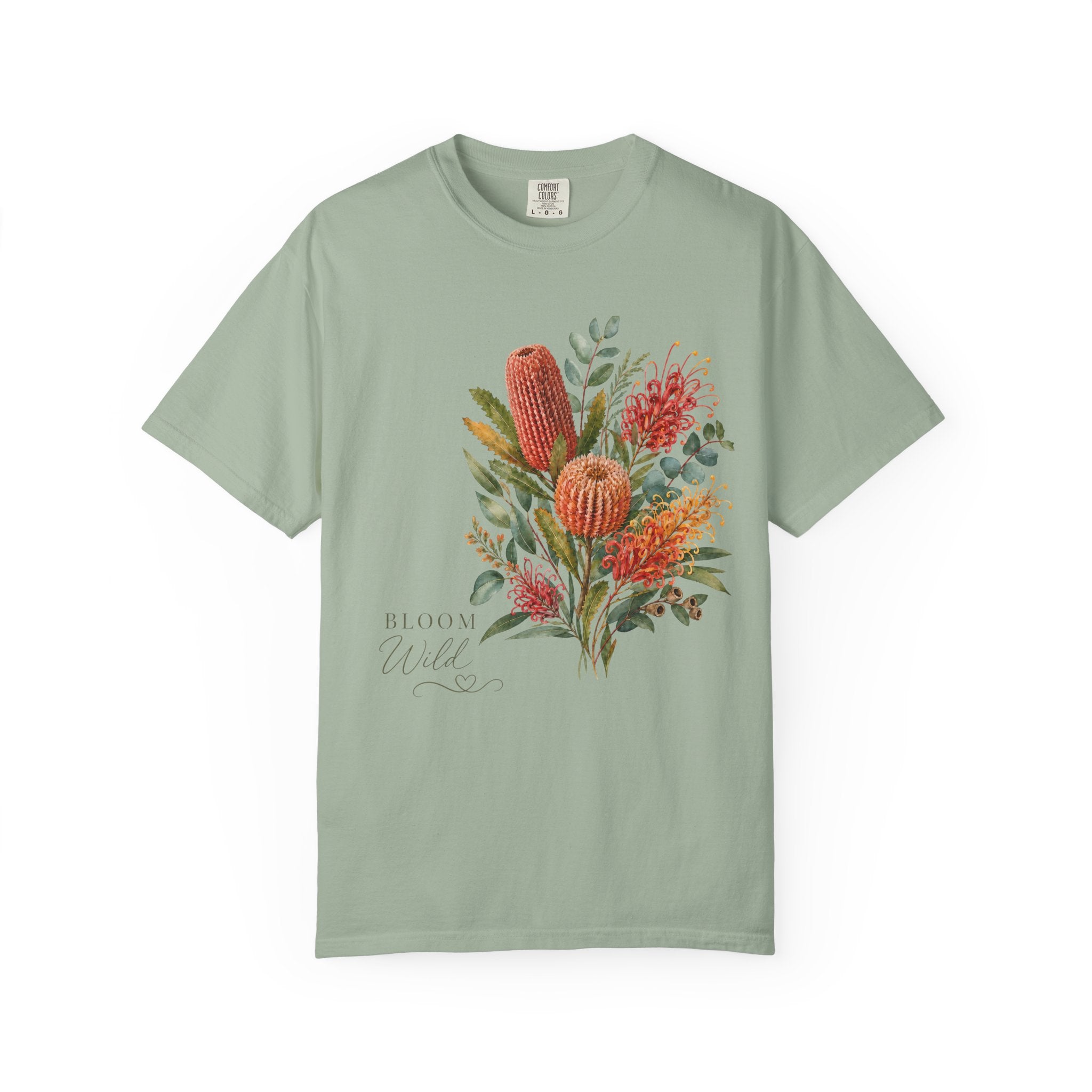 Sage green crew-neck t-shirt with colorful protea bouquet graphic and “Bloom Wild”