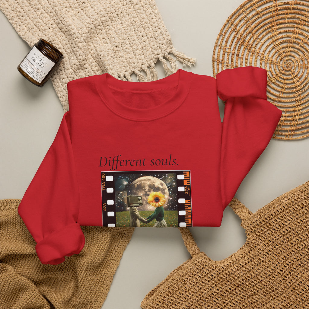 Red crewneck sweatshirt laid flat with chest film-strip graphic artwork