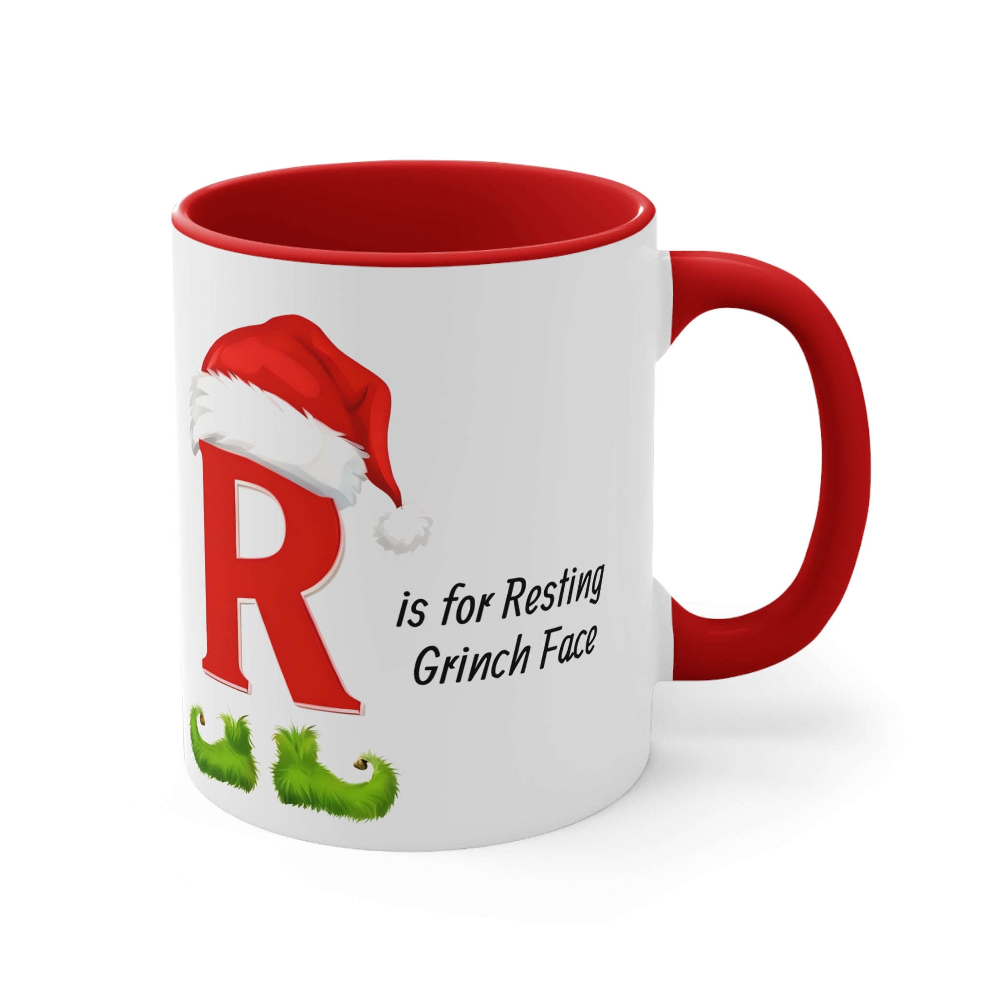 Red interior white mug with red handle, letter R resting Grinch face holiday graphic