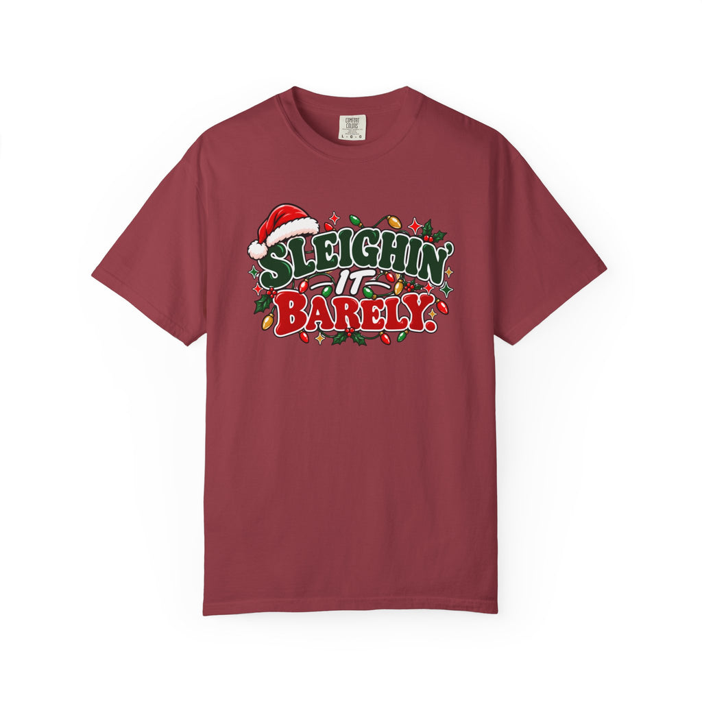 Burgundy crewneck t-shirt with "Sleighin' It Barely" holiday graphic print