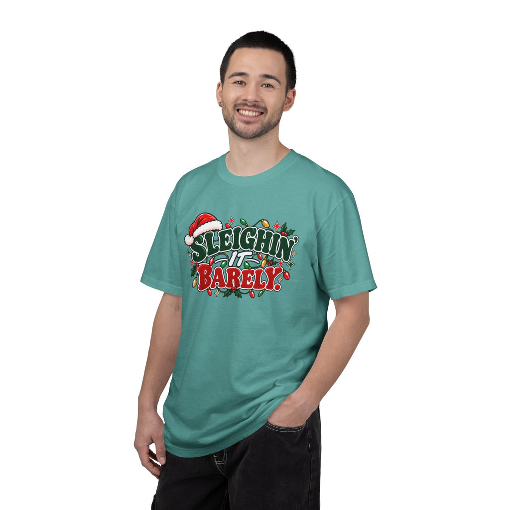 Teal crew-neck T-shirt on model, 'Sleighin' It Barely' holiday graphic