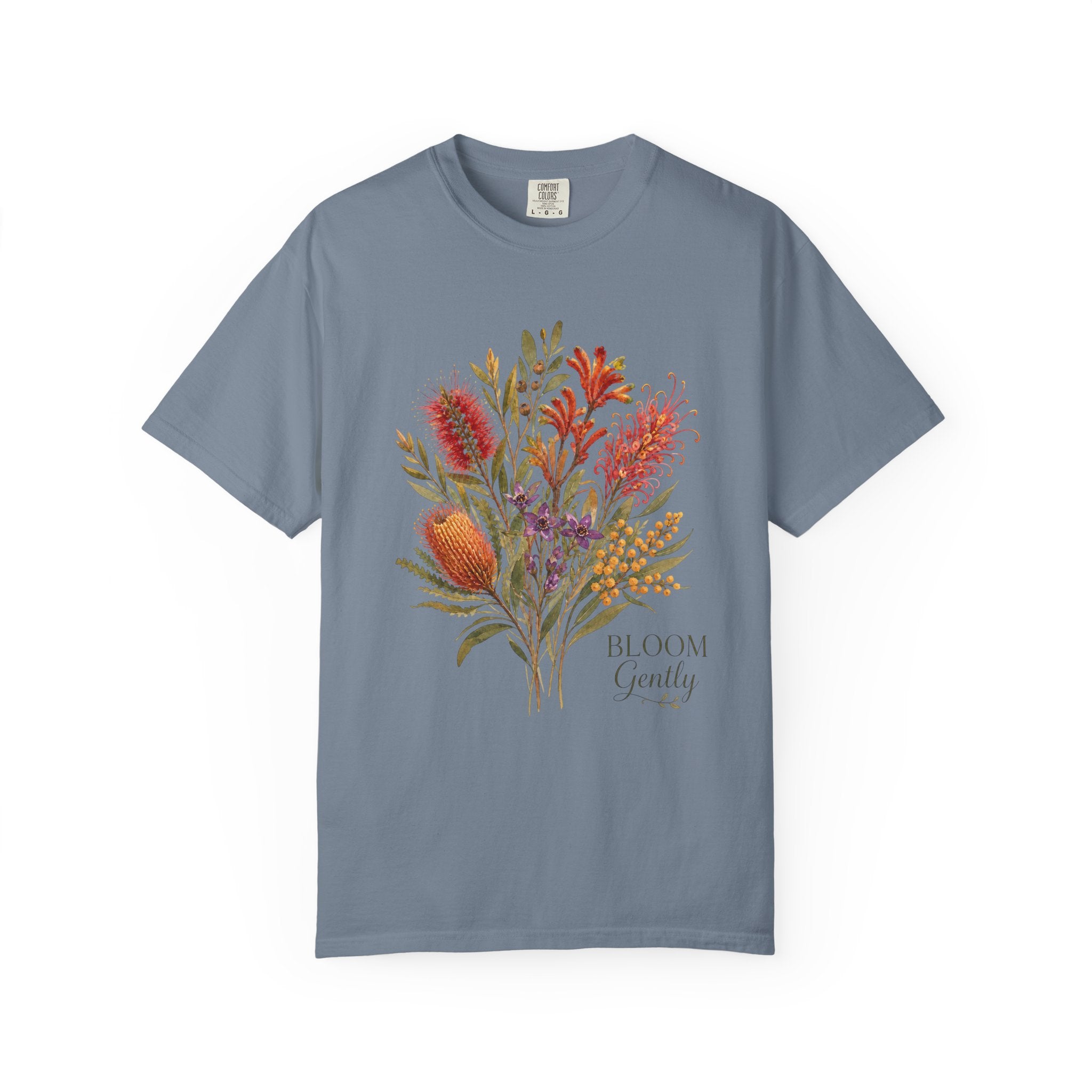 Blue jean blue floral bouquet graphic t-shirt with “Bloom Gently” text on the chest.