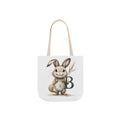 Canvas tote bag with bunny graphic and green letter B, beige straps