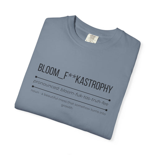 Blue graphic T-shirt with “BLOOM_F**KASTROPHY” slogan and small paragraph text