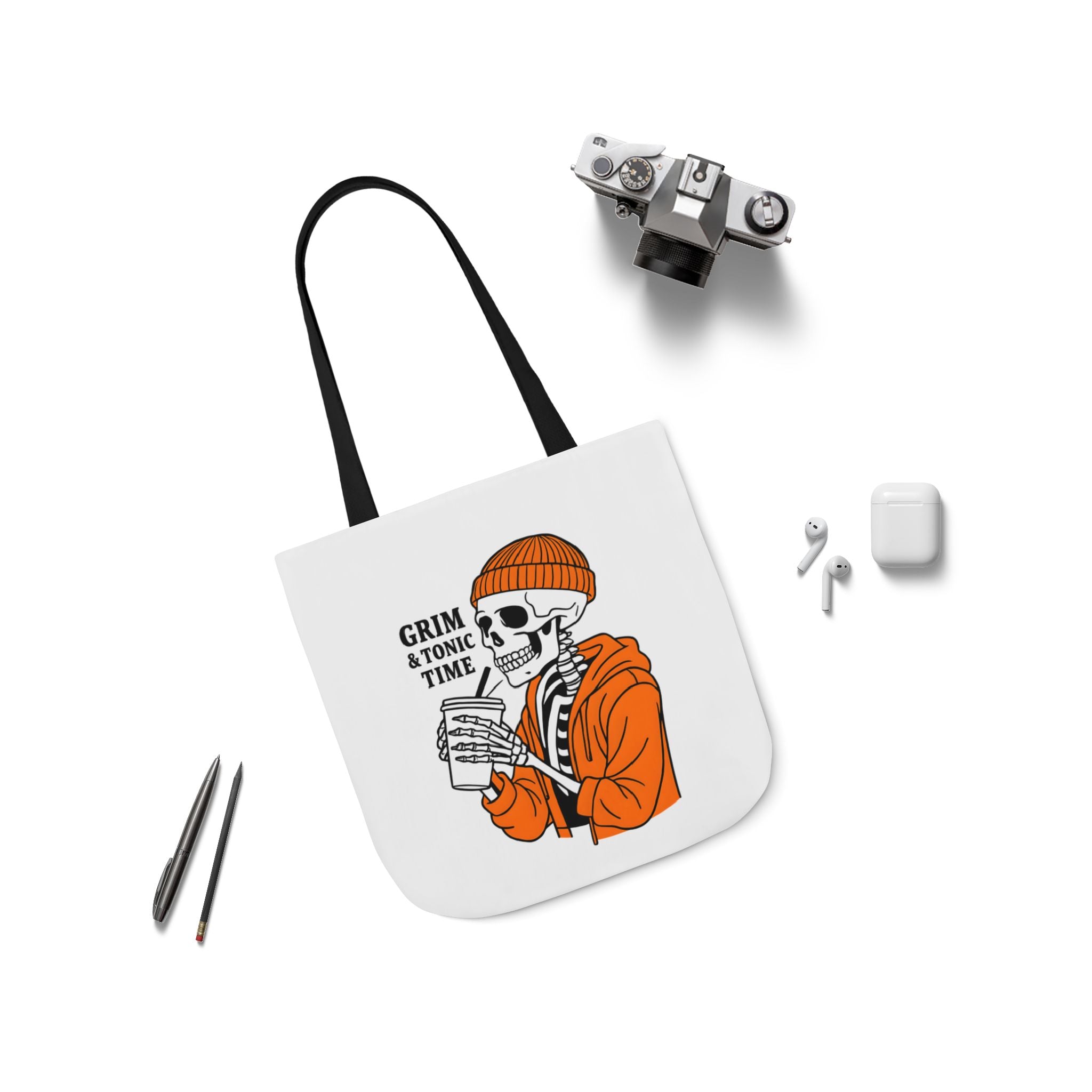 Canvas tote bag on white; black handles and Grim & Tonic Time skeleton in orange