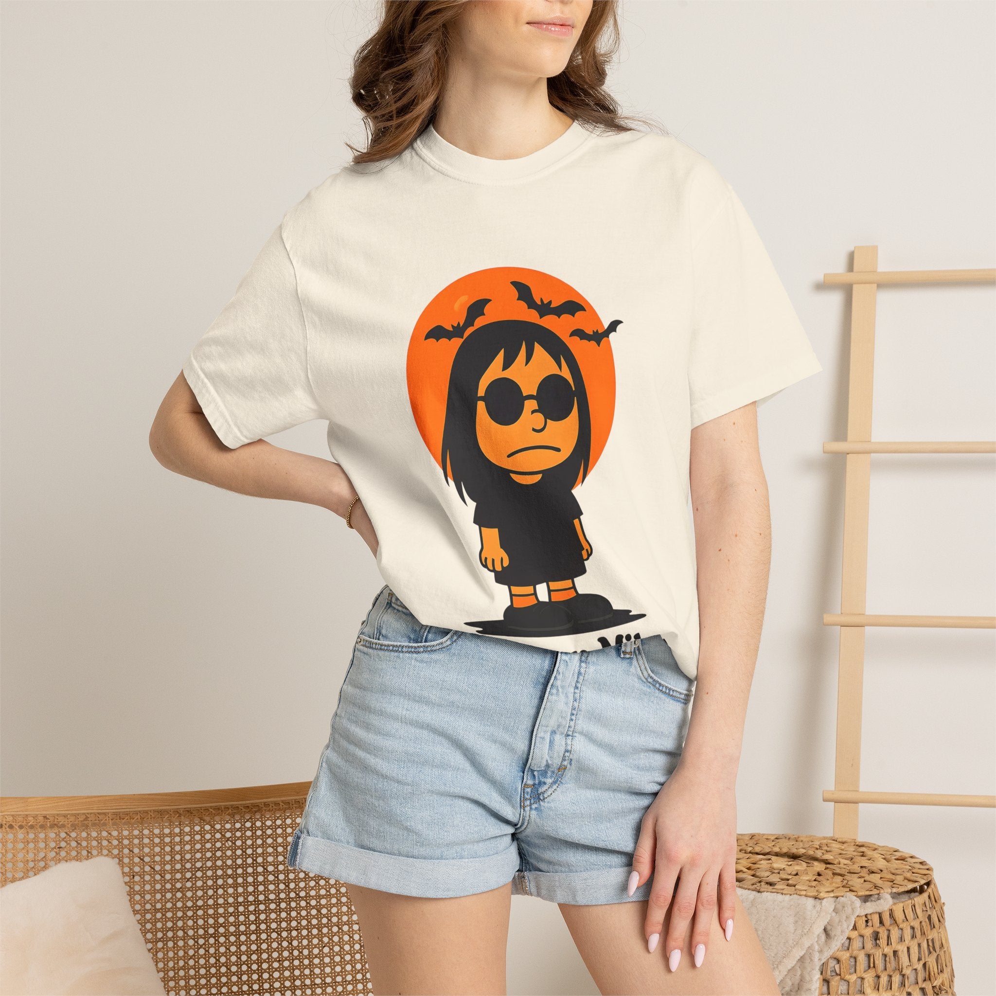 Ivory unisex T-shirt worn by model, Halloween character graphic on the chest