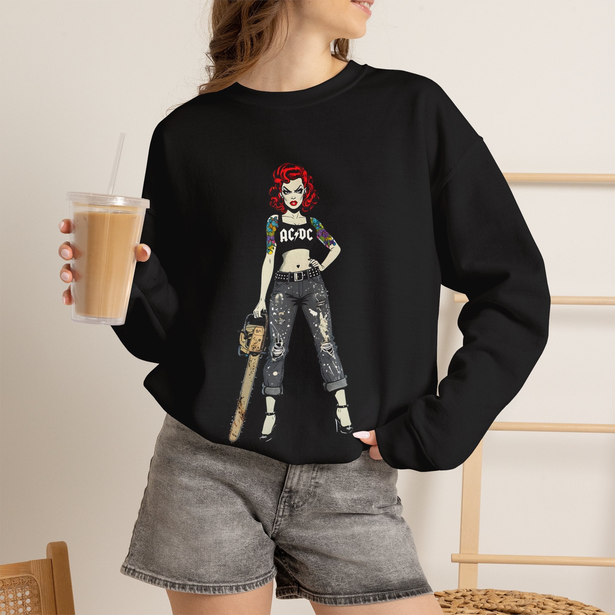 Black crewneck sweatshirt with AC/DC comic-style character graphic on chest