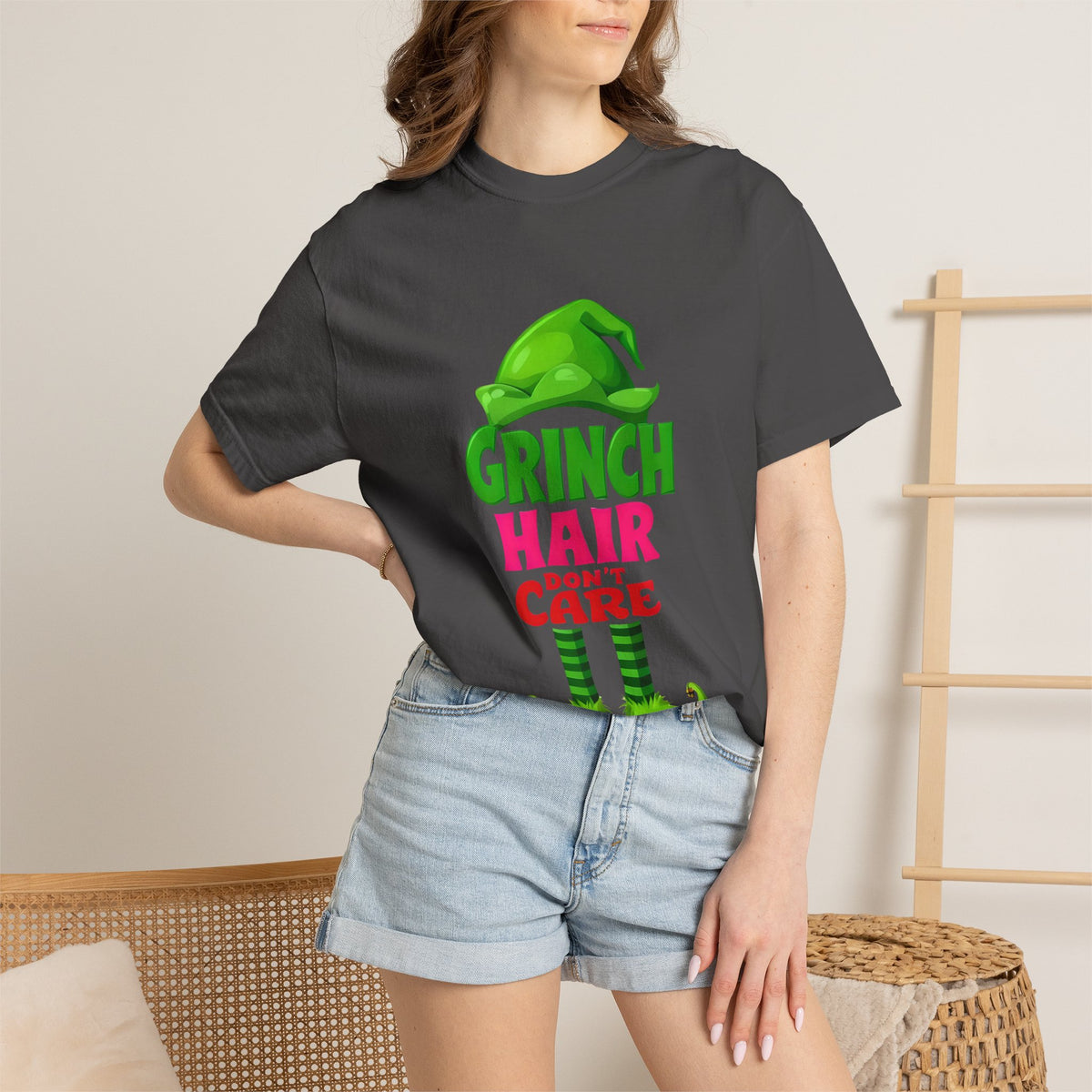 Black graphic T-shirt with colorful Grinch Hair Care front print