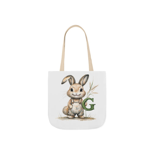 Beige canvas tote bag with bunny illustration and green letter G on front