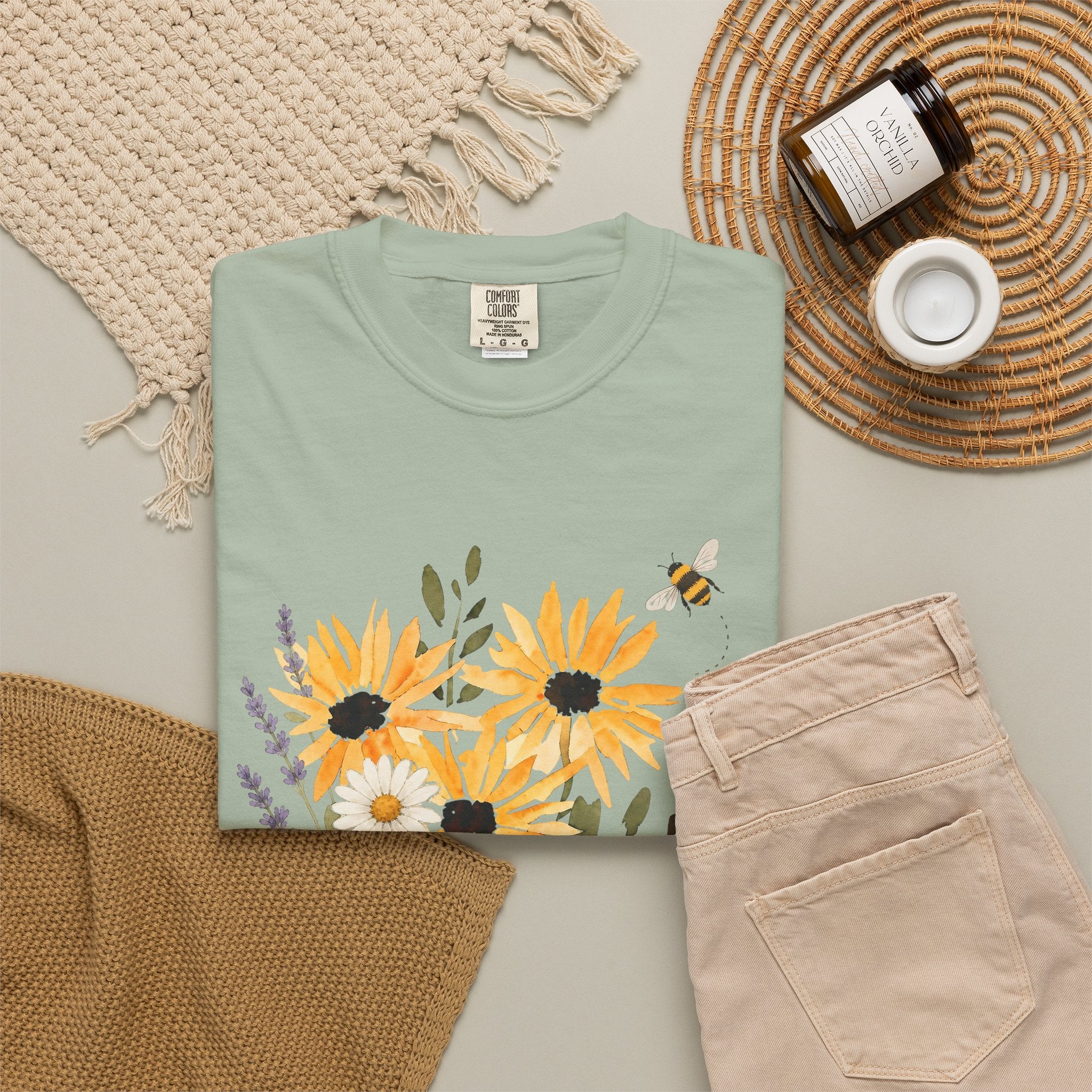 Sage green crew-neck t-shirt with sunflower, lavender bouquet and bee graphic
