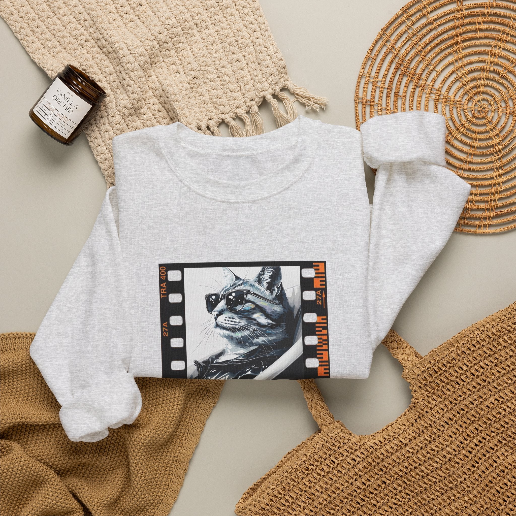 White crewneck sweatshirt with cat film-strip graphic on front