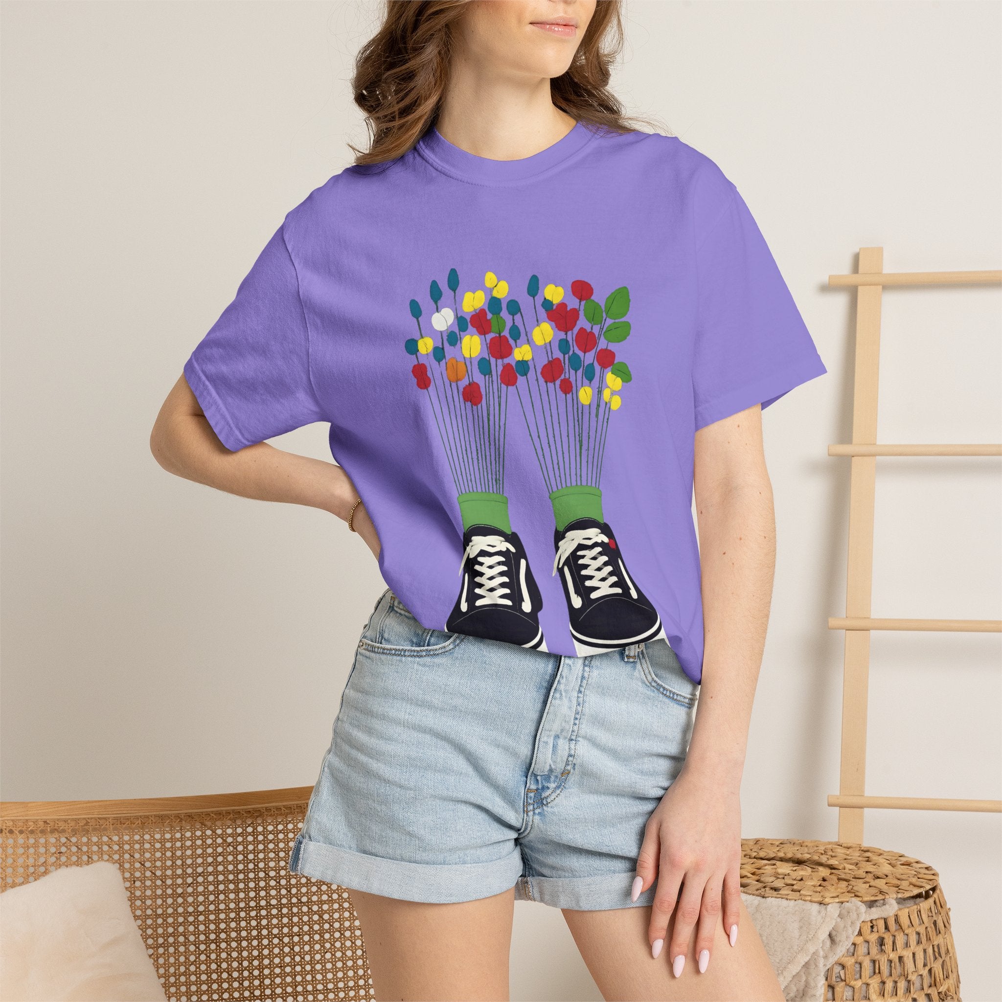 Purple T-shirt with sneaker-and-flowers graphic on the front