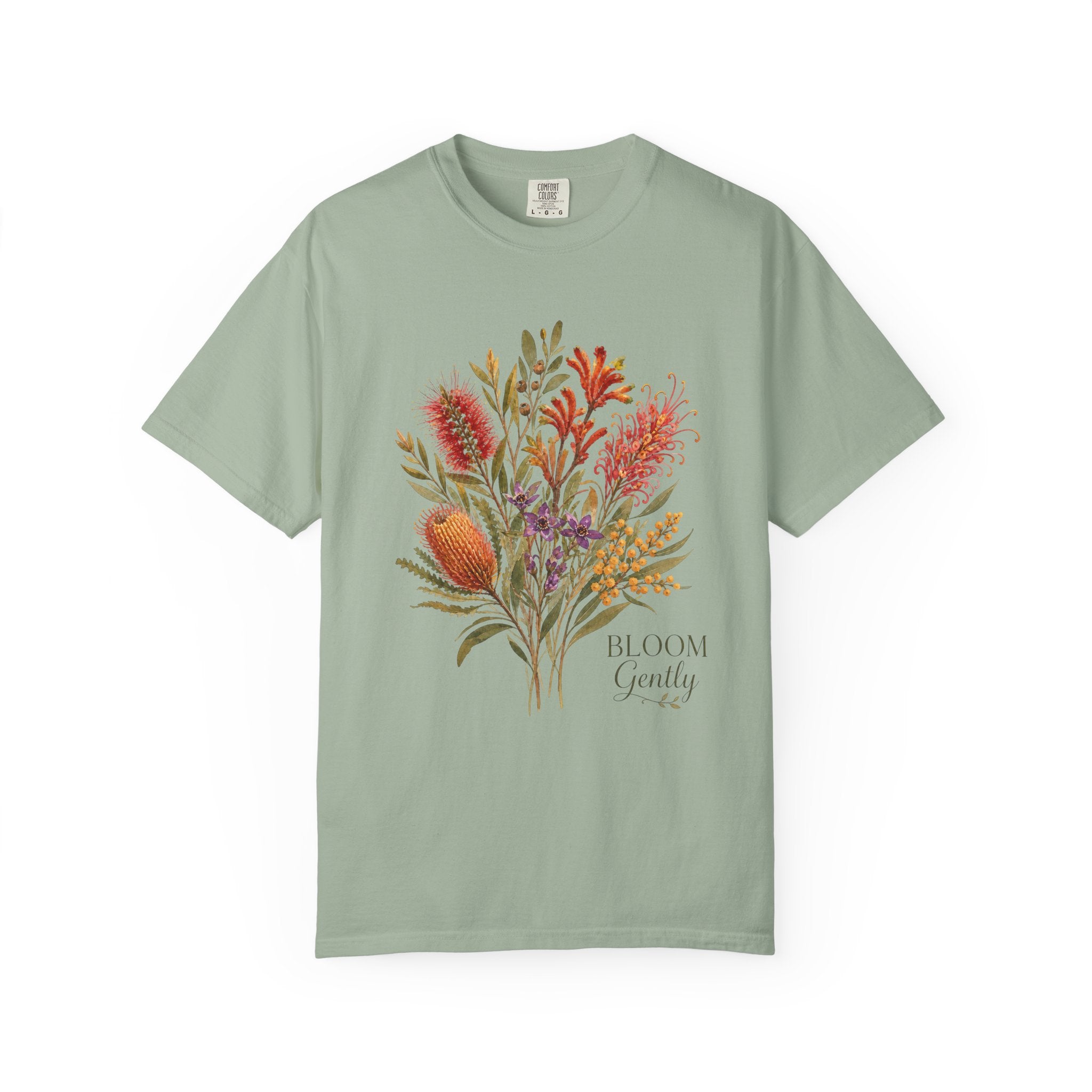 Sage green floral bouquet graphic t-shirt with “Bloom Gently” text on the chest.