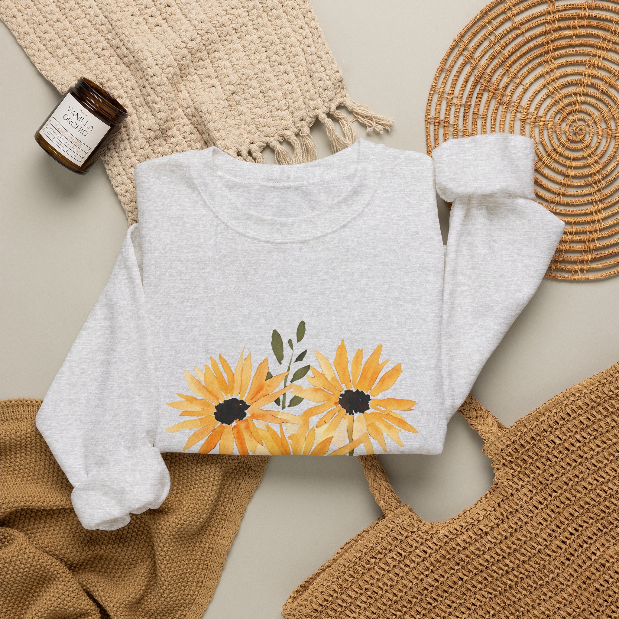 Light grey crewneck sweatshirt with orange sunflower bouquet graphic on the front