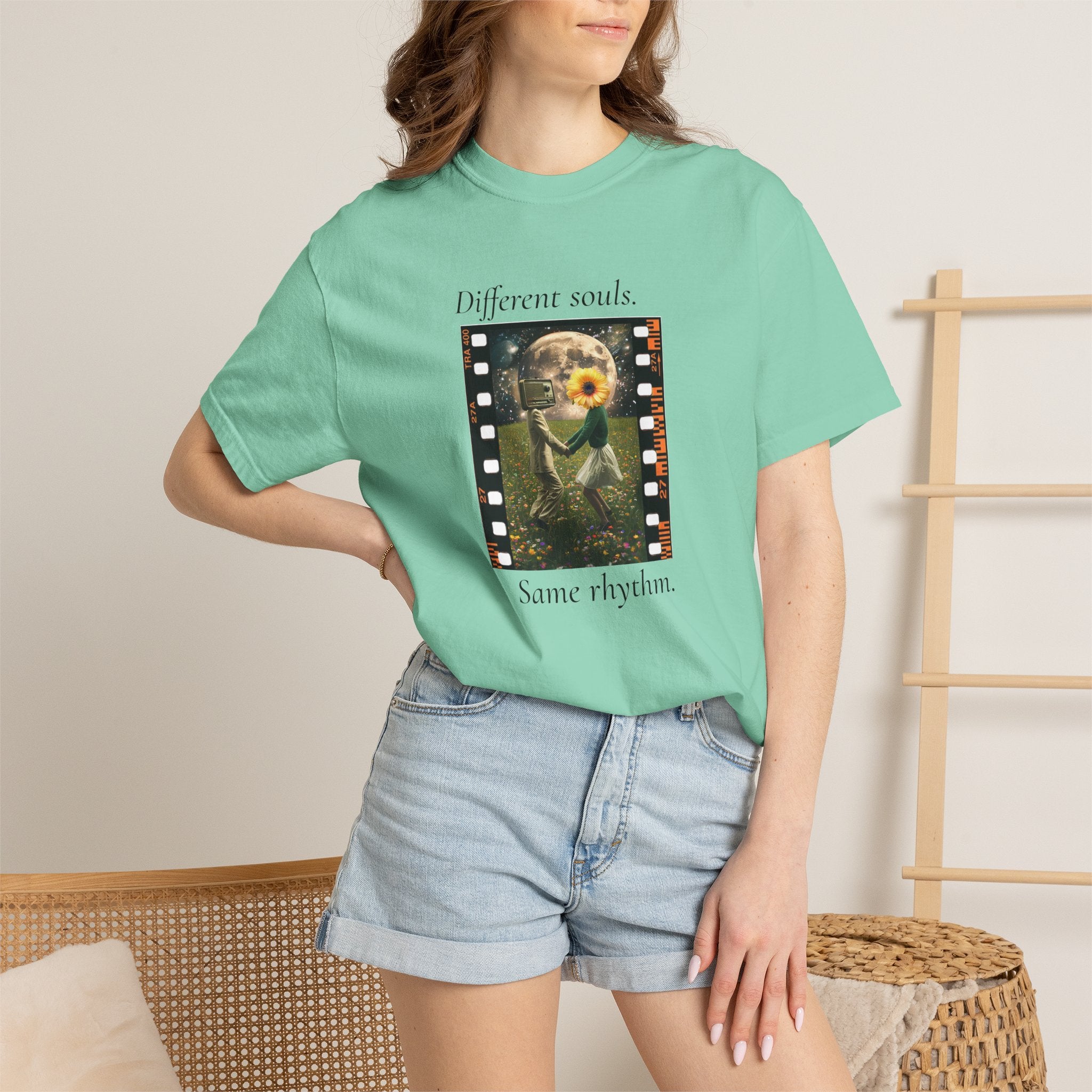 Teal crew-neck short-sleeve tee on model, with filmstrip sunflower front print
