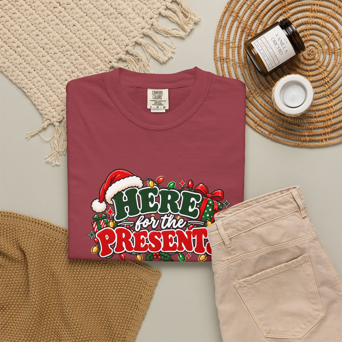 Red graphic Christmas T-shirt front view with “Here for the Presents” design