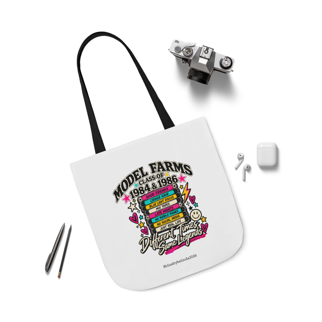 White canvas tote bag with black strap and multicolor “Model Farms” style emblem