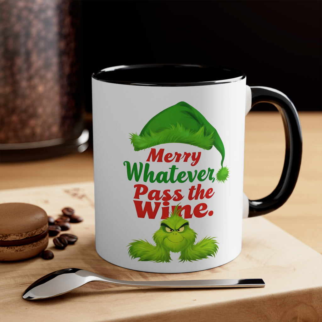 White mug with black rim and handle, green holiday character, 'Merry Whatever Pass the Wine.'