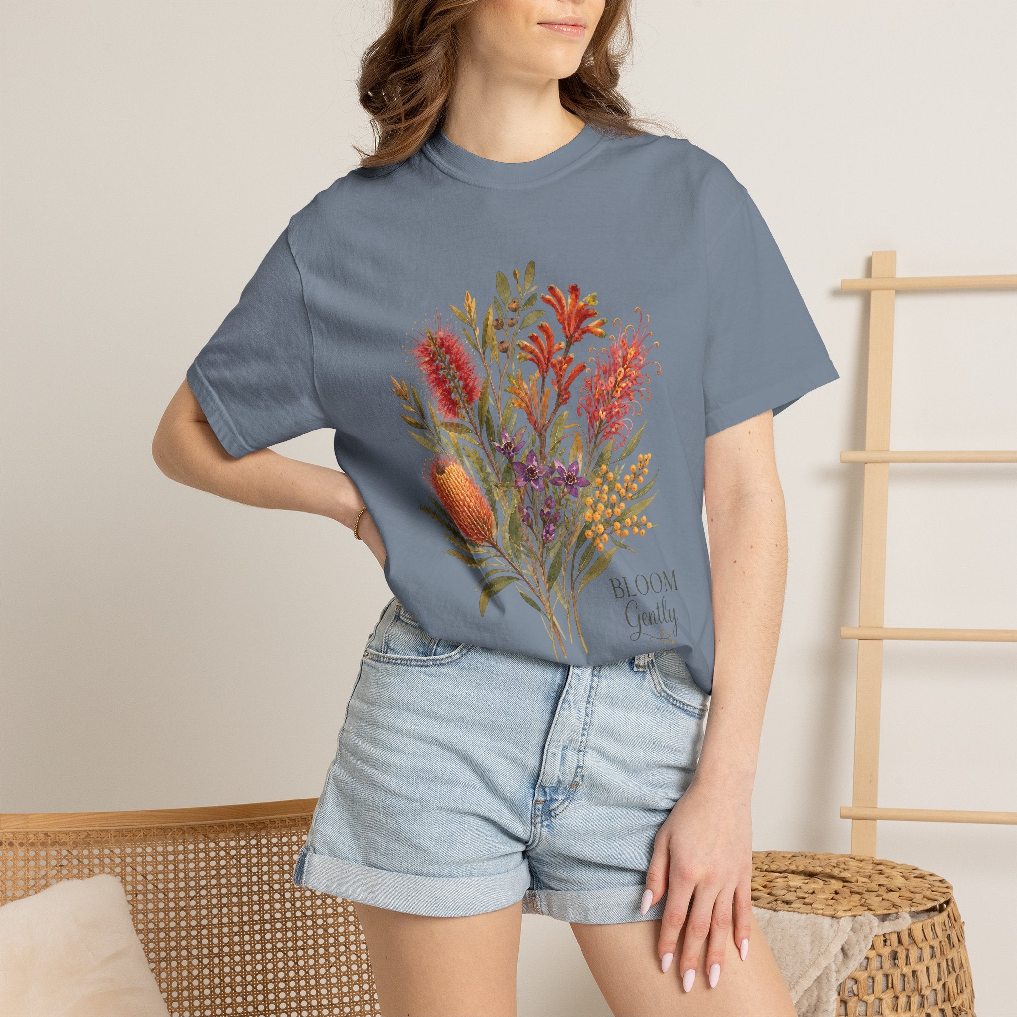 Blue jean crew-neck T-shirt with botanical bouquet graphic in orange and purple