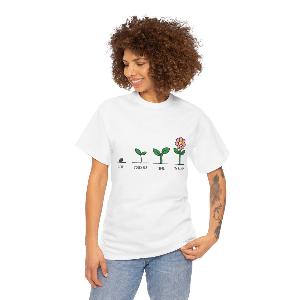 White graphic t-shirt with green plant growth line and pink flower icon print, model wearing