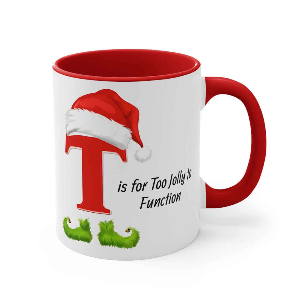 White coffee mug with red handle, red T and Santa hat, green whiskers, angled view, Too Jolly