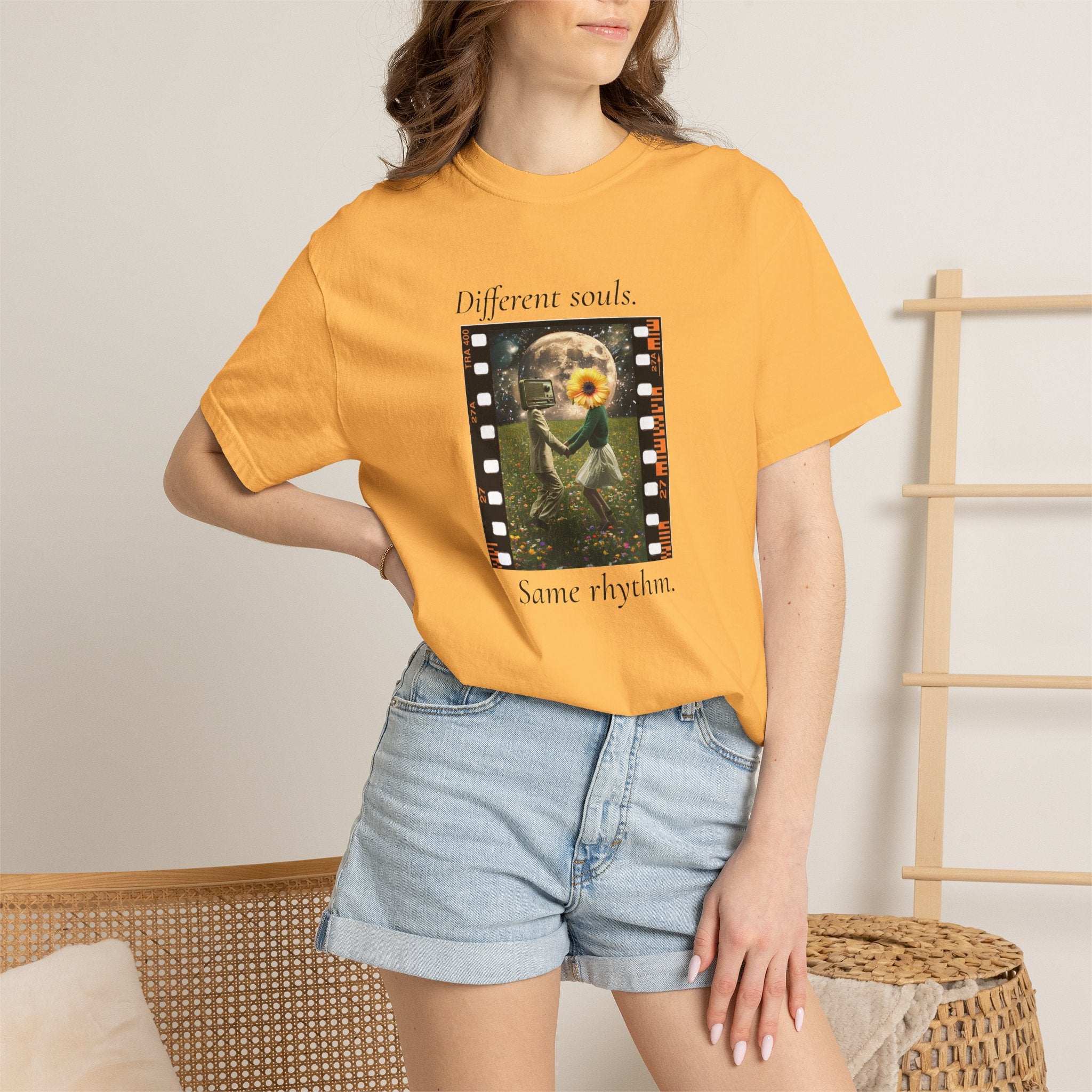 Orange crew-neck tee on model with 'Different souls' filmstrip graphic