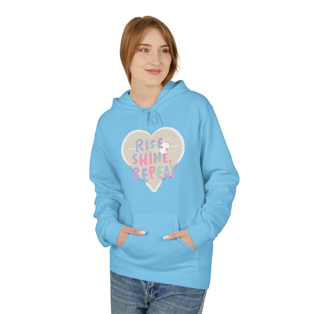 Sky blue hoodie with heart graphic reading Rise Shine Repeat, front pocket, hood drawstring